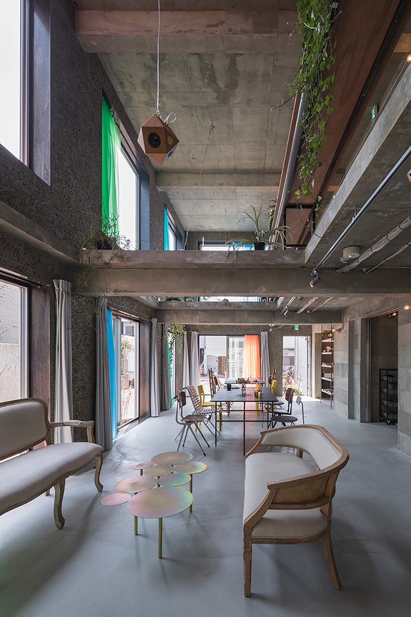 Tato Architects creates painted effect to this concrete hotel by using colourful curtains in Osaka