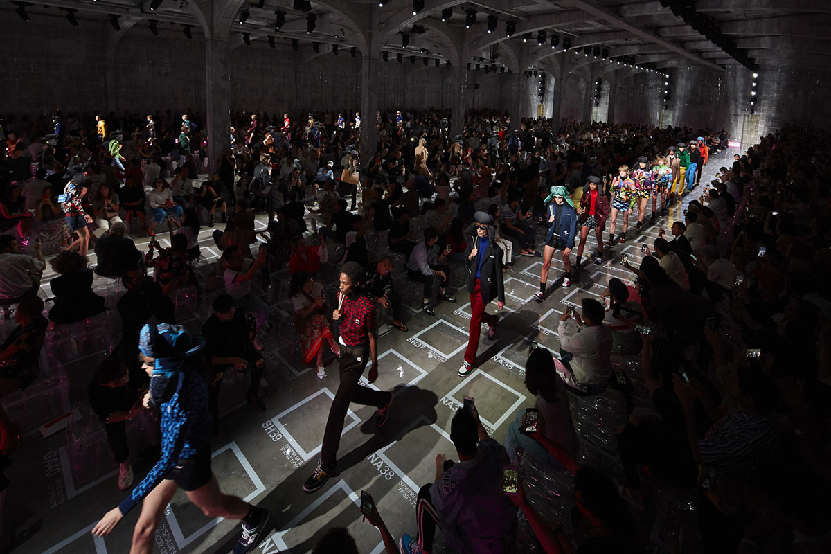 AMO filled Prada's fashion show stage with purple-lit inflatable stools