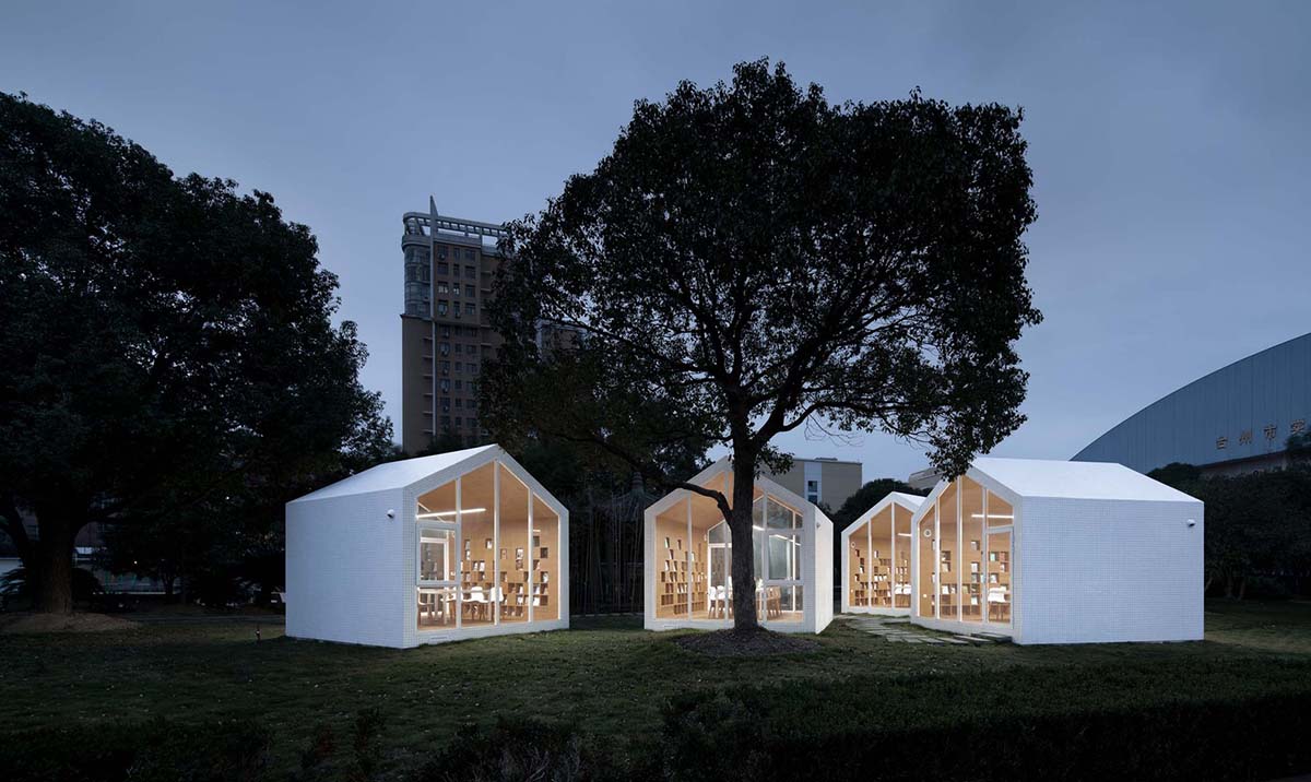 Four mini cabins by Yuan Architects scattered in a forest to create a reading village in Taizhou City