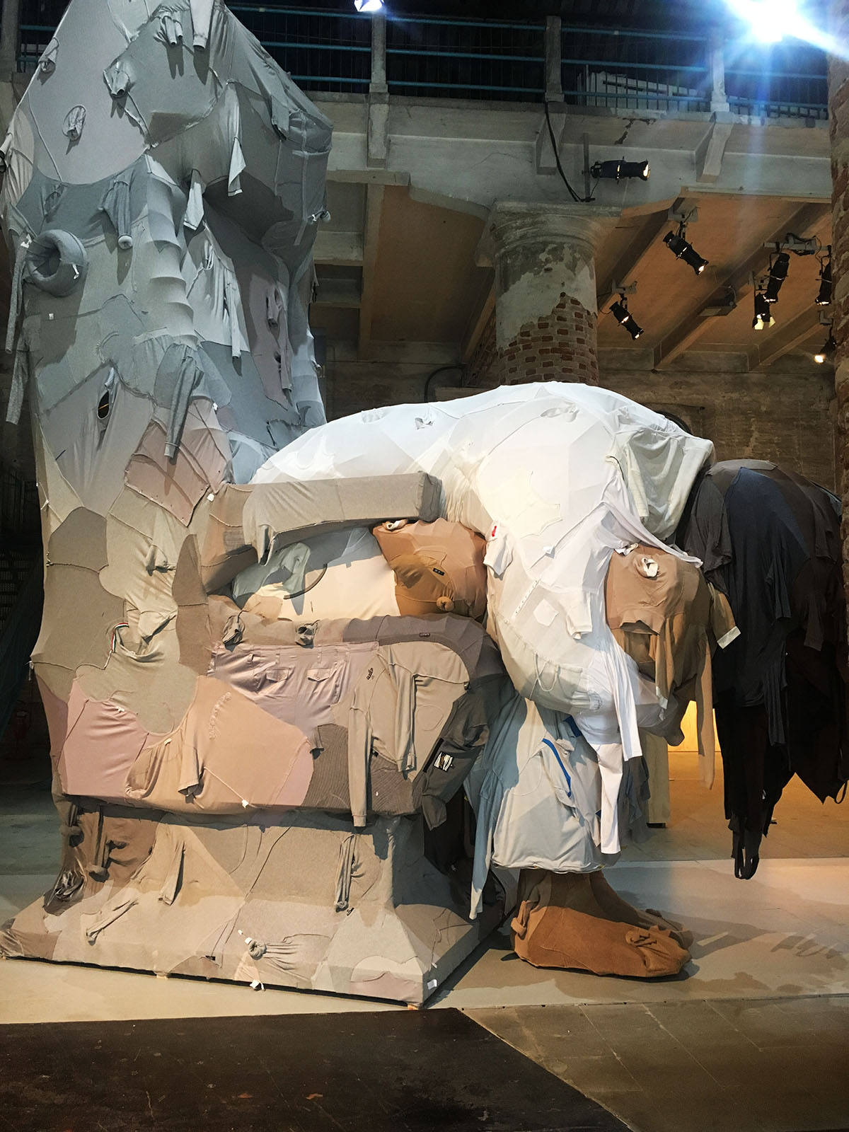 Yin Xiuzhen creates a huge sculpture of a woman wrapped by disused clothes at Venice Art Biennale