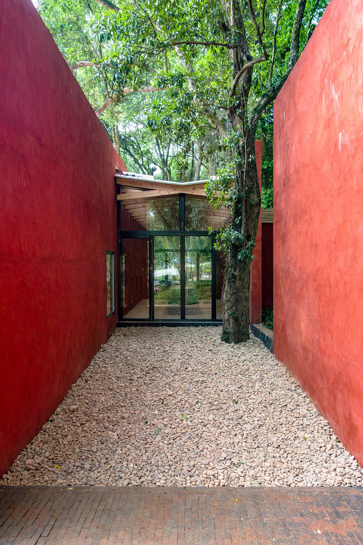 Children attend teaching courses in between red-colored free standing walls in rural village of China