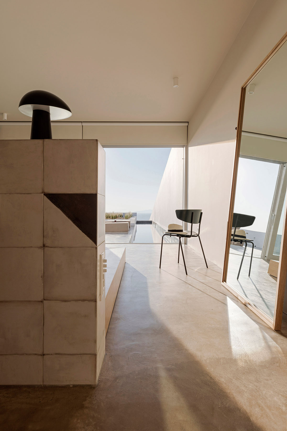 Kapsimalis Architects adds this summer villa featuring orthogonal lines to the Santorini Island