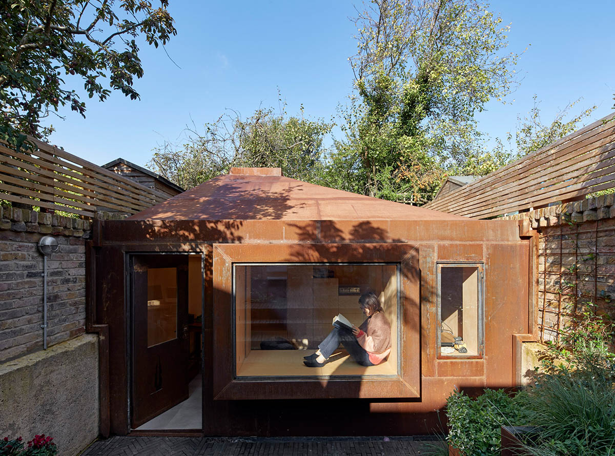 RISE Design Studio built sunken garden studio with rusted steel to provide a hidden place to escape