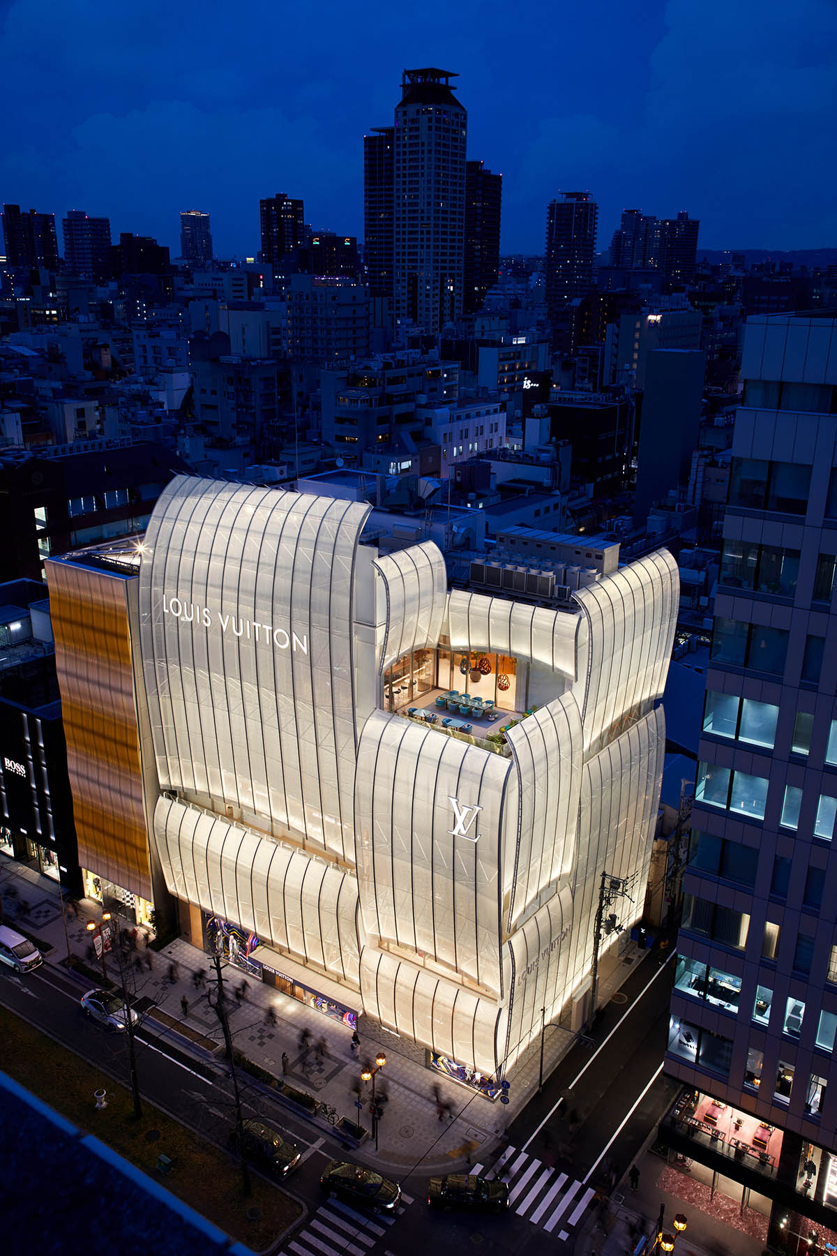 jun aoki's tokyo louis vuitton store features patterned façades