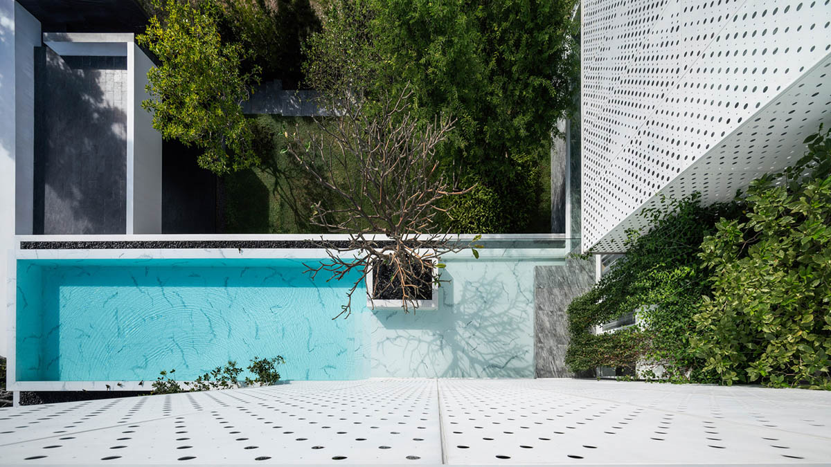 AAd built self-sustainable residence with perforated facade and steel rods in Thailand