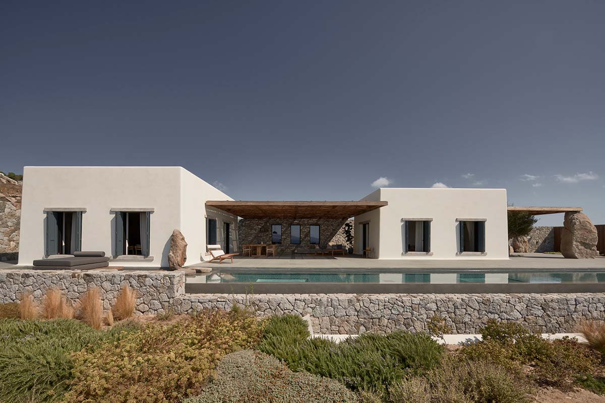 K Studio built small holiday villa with round-edged volumes and shading elements in Mykonos