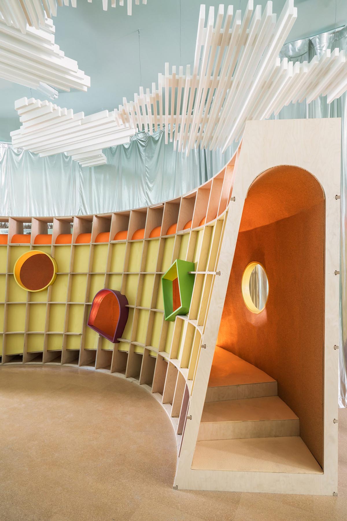 Architensions uses abstract elements of nature for children's playground made of plywood structures