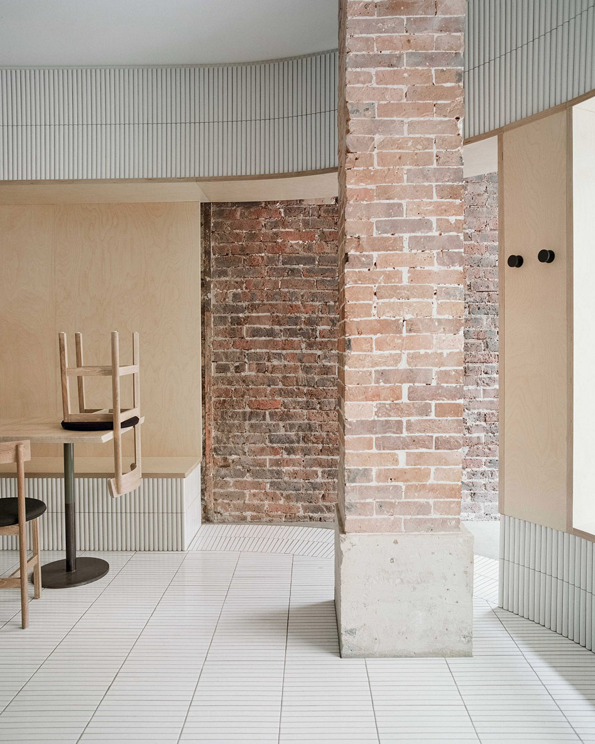 Neri&Hu-designed restaurant in Paris exposes layering material history with oblong volume inside