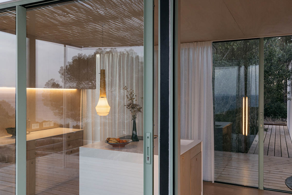 Ignacio de la Vega and Pilar Cano-Lasso create T-shaped cabin framing views from the Mediterranean