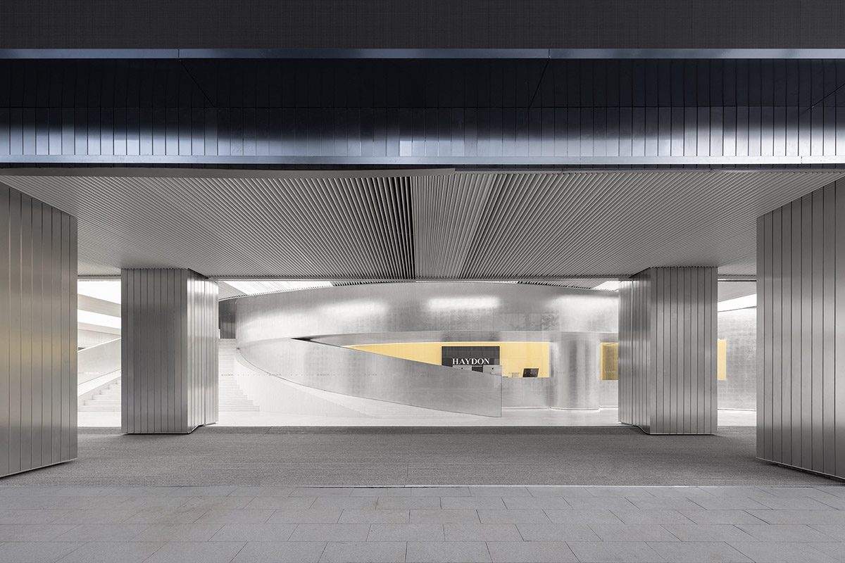 Various Associates designs beauty store with winding staircase and silver-toned interiors in Hangzhou