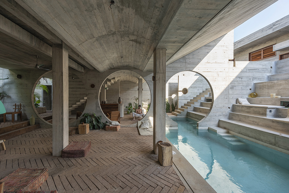 Casa TO by Ludwig Godefroy features an island of stairs and vaulted volumes to create discreet oasis