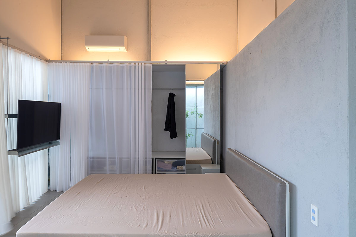 MIA Design Studio completes family house with angular roof in Vietnam 