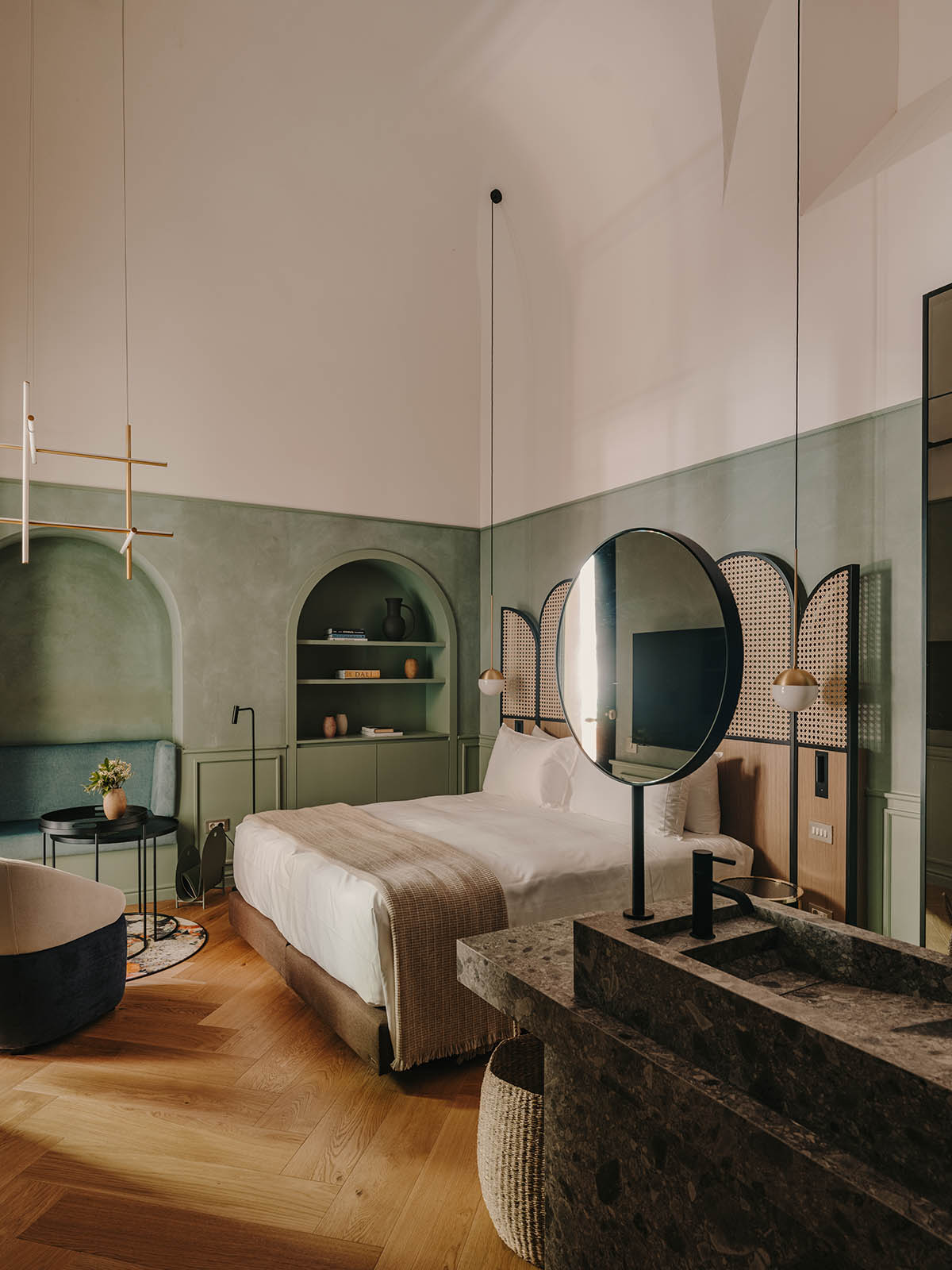 El Equipo Creativo converts 18th-century palace into hotel with rich textures and colors in Girona