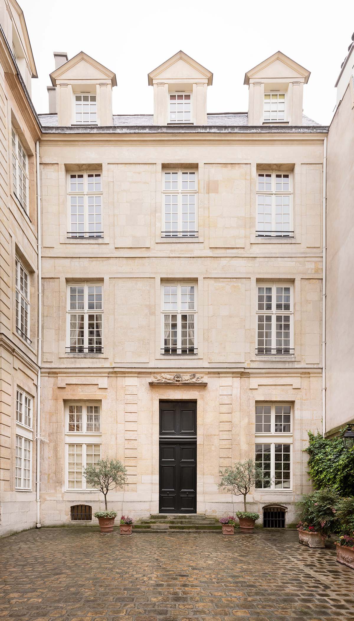 Wood Marsh adds a soft and warm colour palette to historic Paris Apartment 