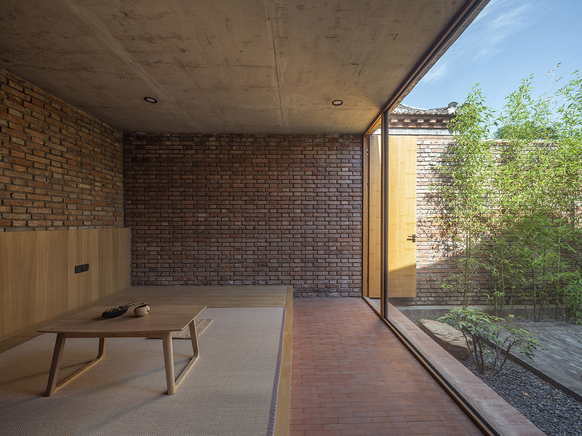 Archstudio renovates Beijing's old courtyard house with new wooden additions 