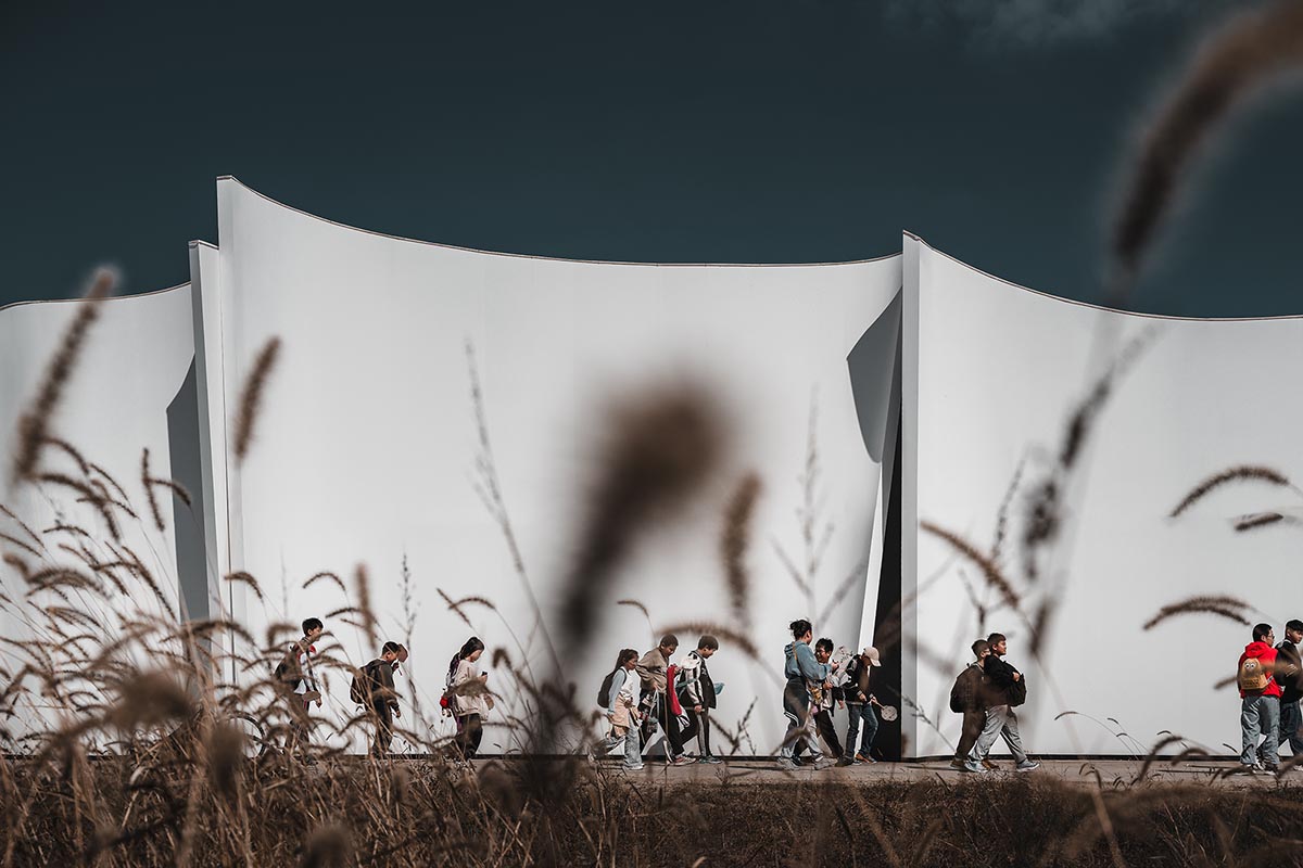 Chinese chapel creates a fluid silhouette featuring curving walls to mimic blossoming petals 