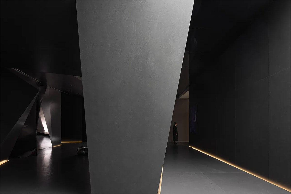 Exhibition hall interiors feature sharp angles and surfaces addressing diamond cutting processes