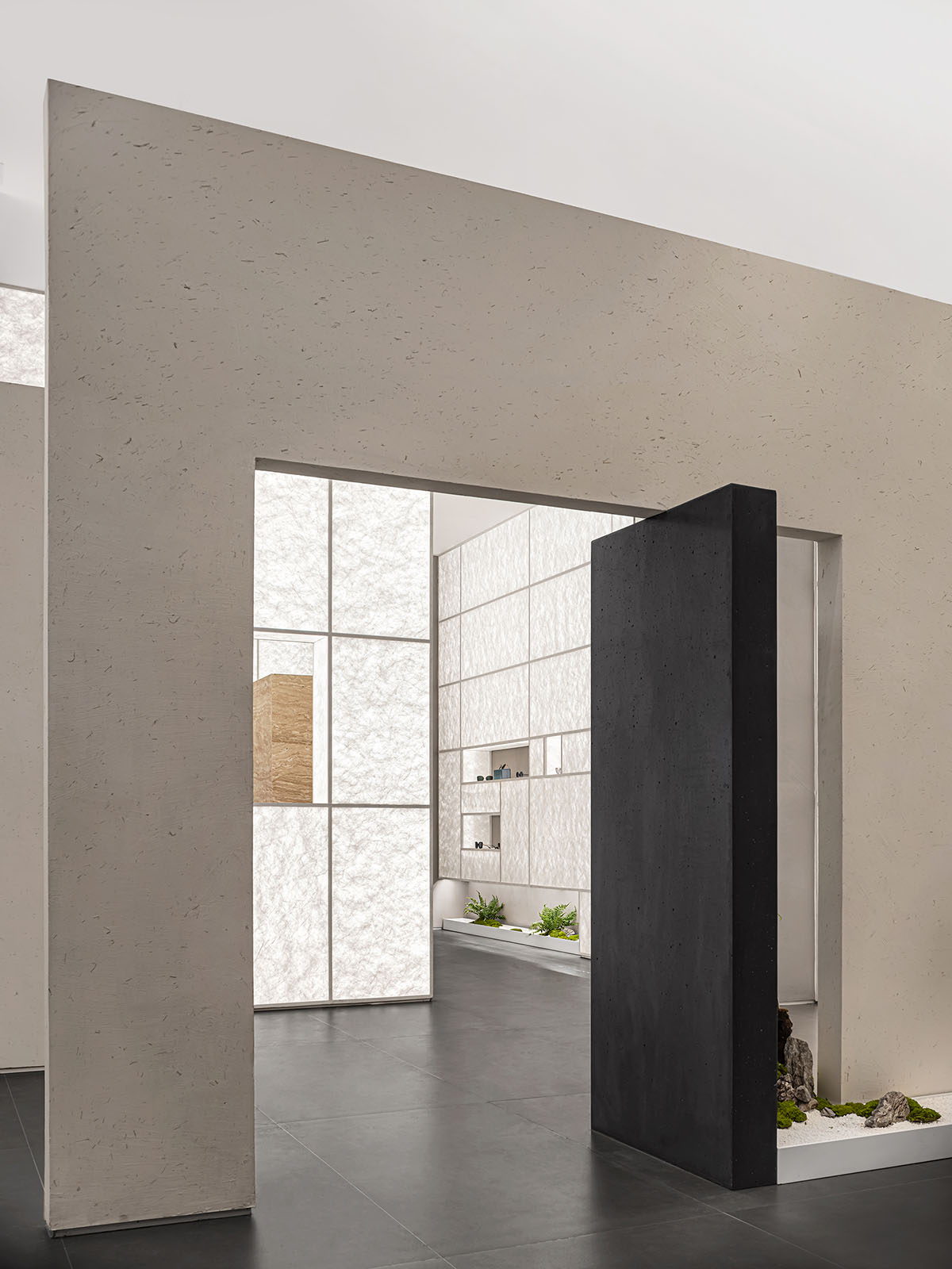 Luminous screen walls create fluid interiors for an optic store designed by Onexn Architects 