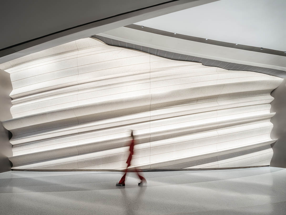 Undulating lines and expansive waves define interior of Orbit public exhibition hall in Shanghai 