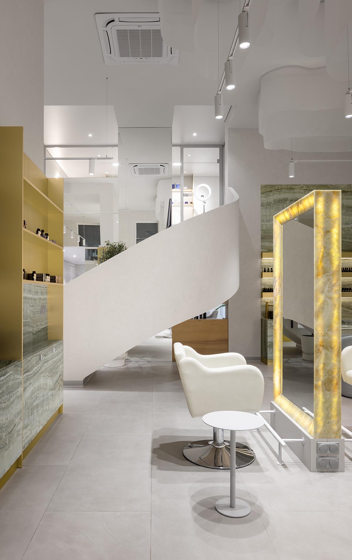 Mirrors and golden frames create a sense of care and deep comfort for beauty salon in Ukraine