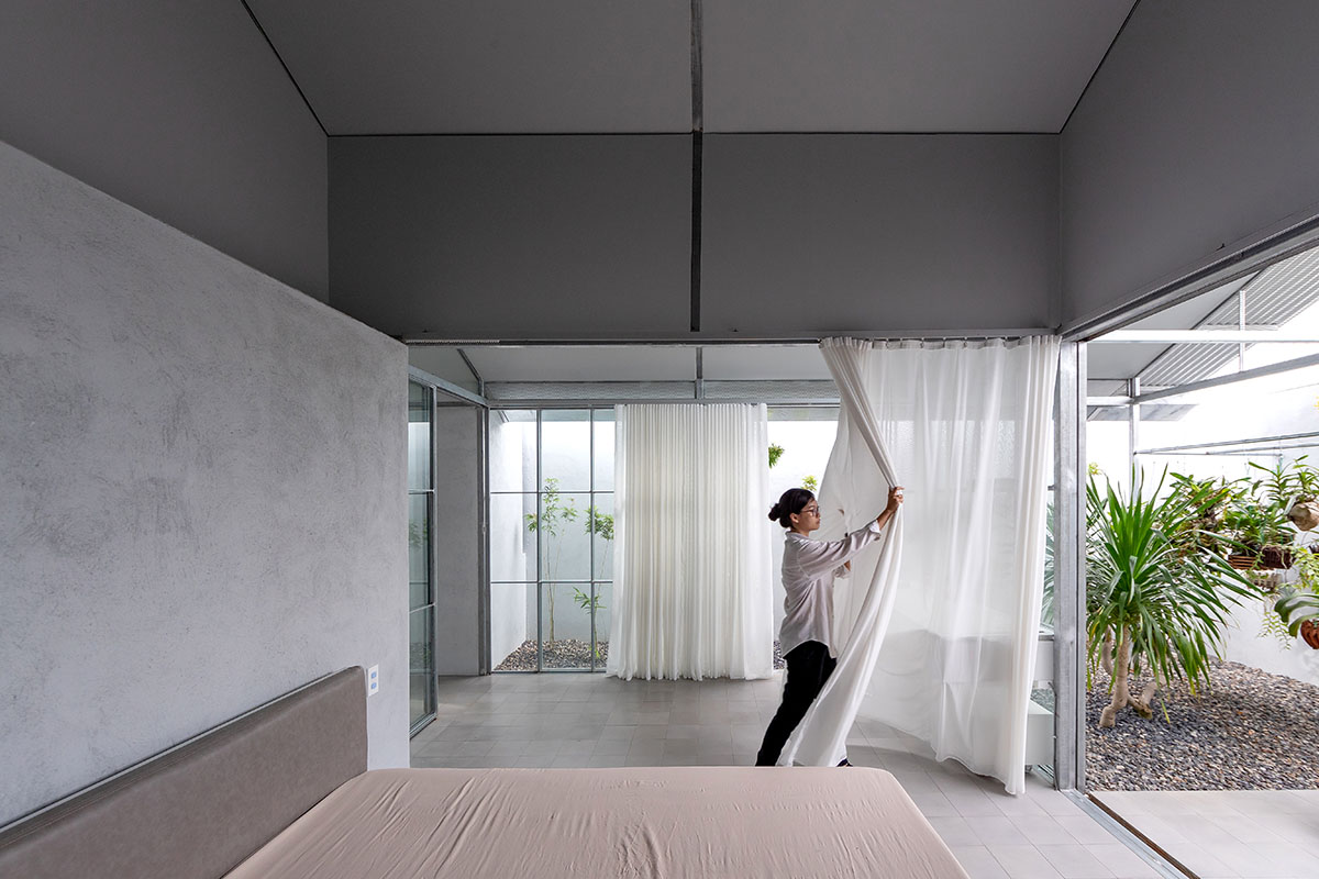 MIA Design Studio completes family house with angular roof in Vietnam 