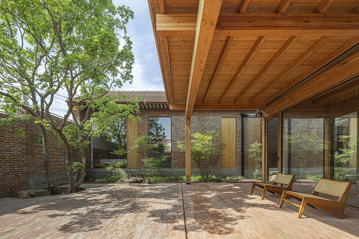 Archstudio renovates Beijing's old courtyard house with new wooden additions 