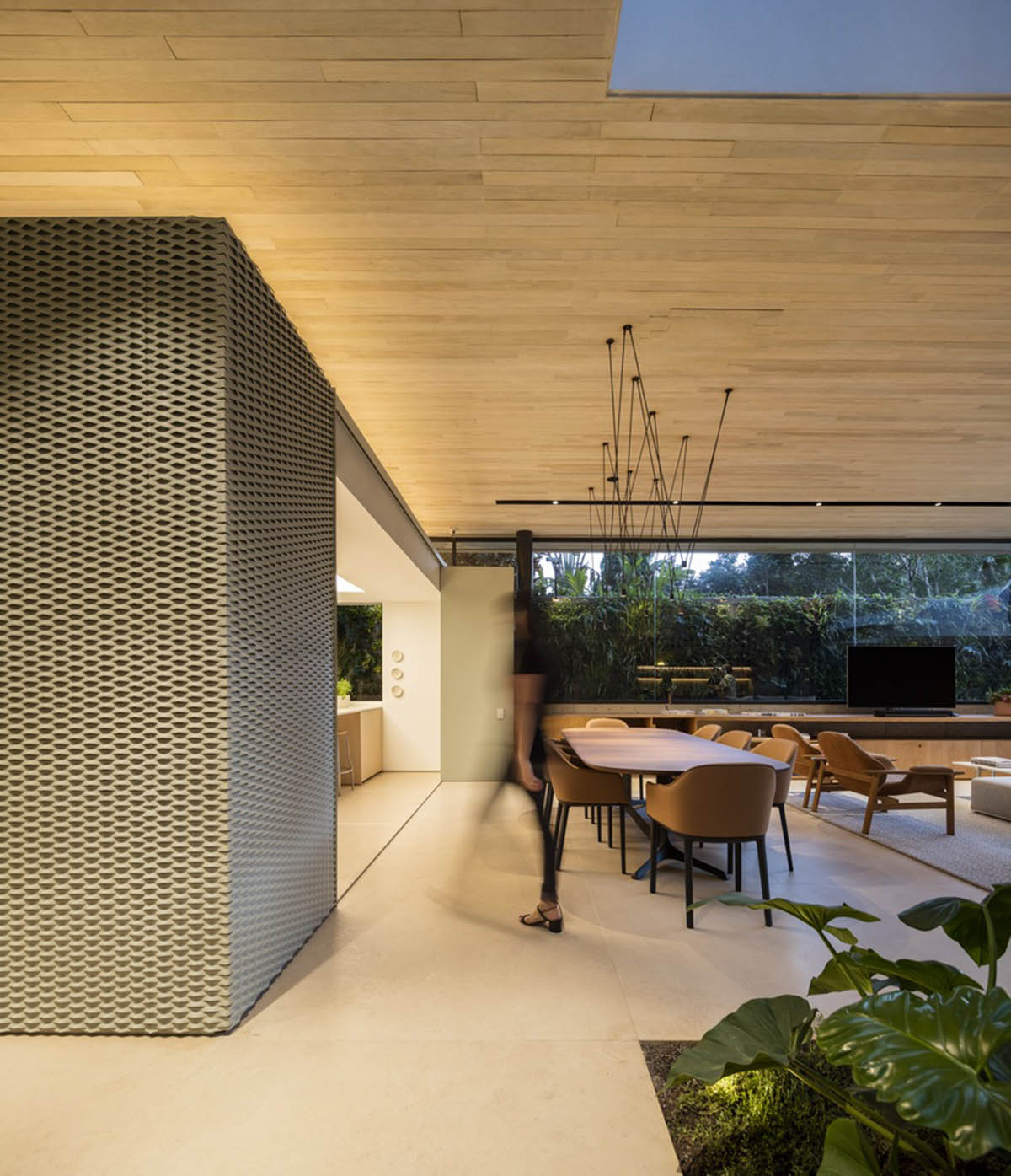 Studio AG designed large wooden residence featuring punctured volumes with gabled roof in São Paulo