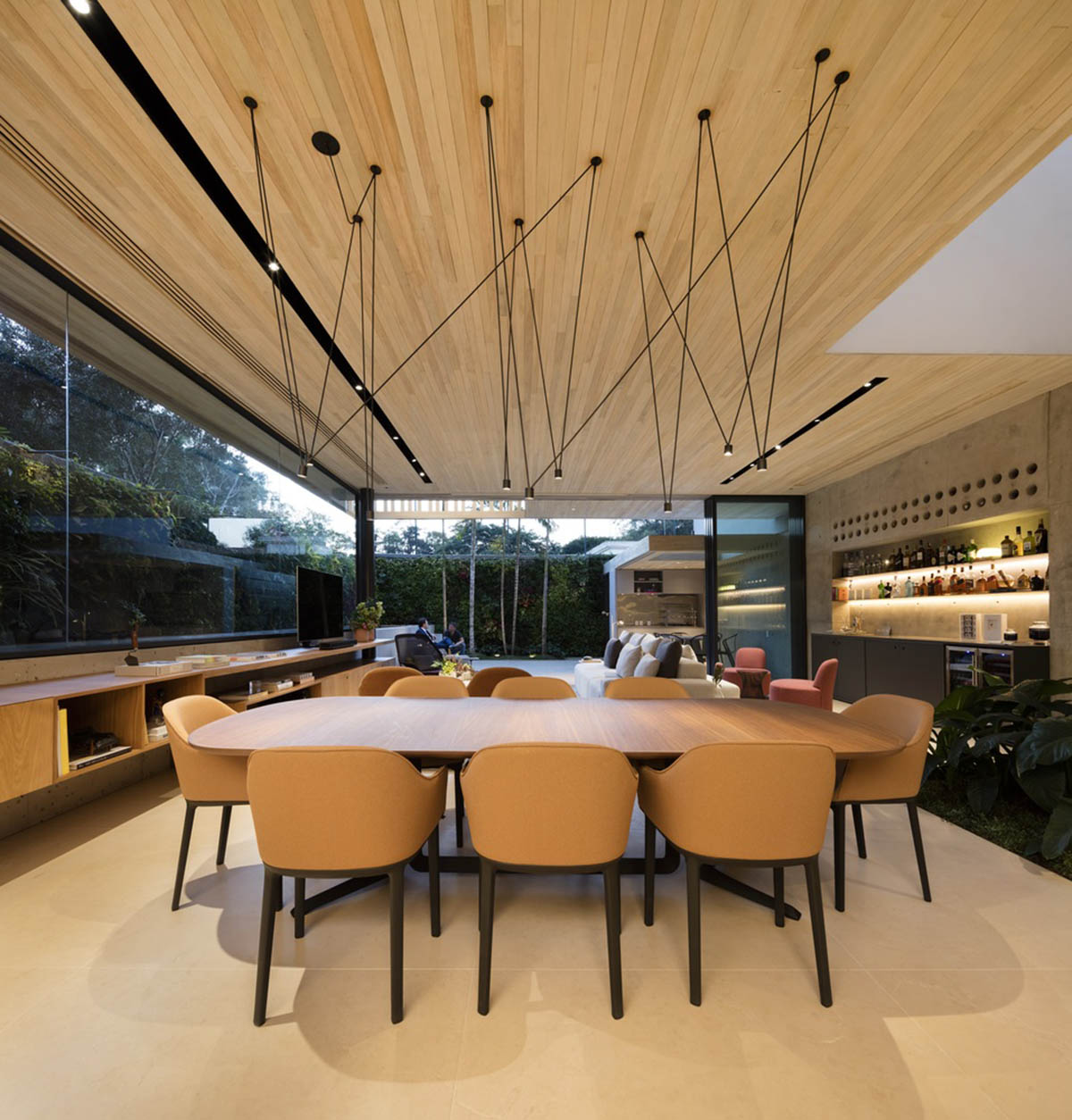Studio AG designed large wooden residence featuring punctured volumes with gabled roof in São Paulo