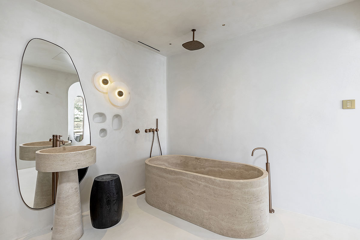 MK Design Studio designs luxurious holiday villa with creamy white walls and stone-walled terraces