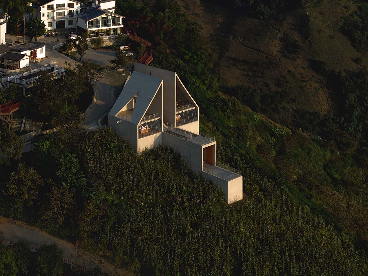TAO completes concrete bookstore with protruding structure on a steep slope in China 