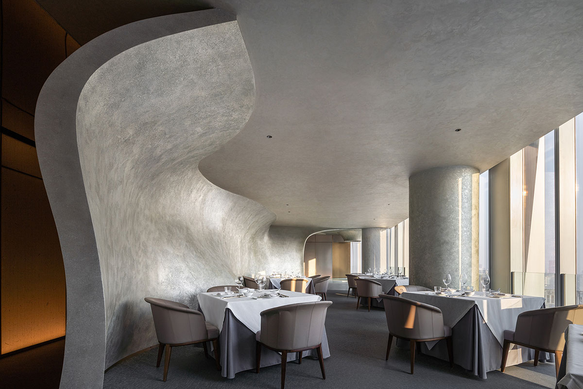 Nature Times Art Design completes restaurant with cave-like wall and garden-themed hall in Hangzhou