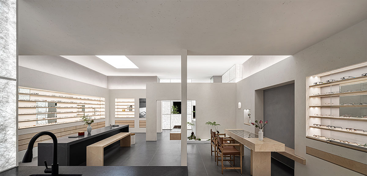 Luminous screen walls create fluid interiors for an optic store designed by Onexn Architects 