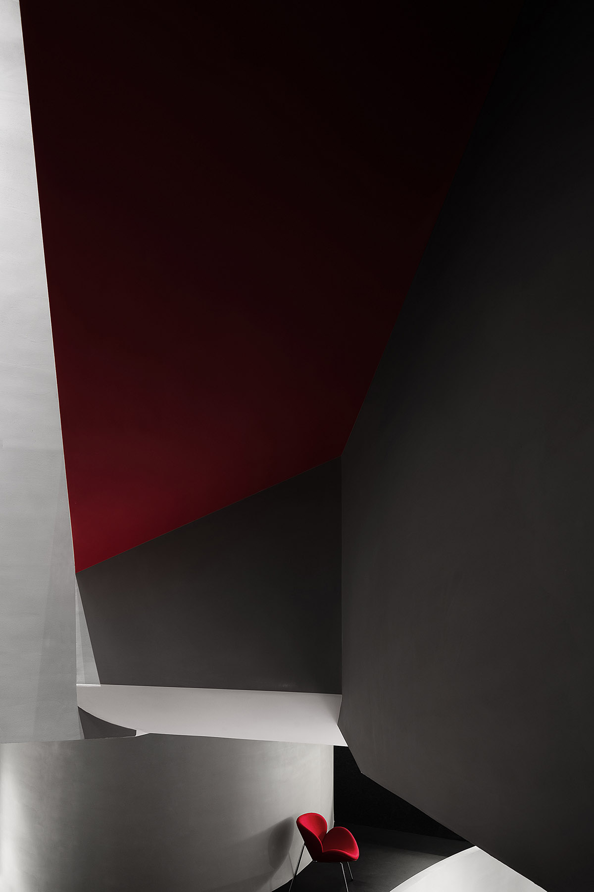 A beauty salon by AD ARCHITECTURE features dark-hued interiors drawing inspiration from cells