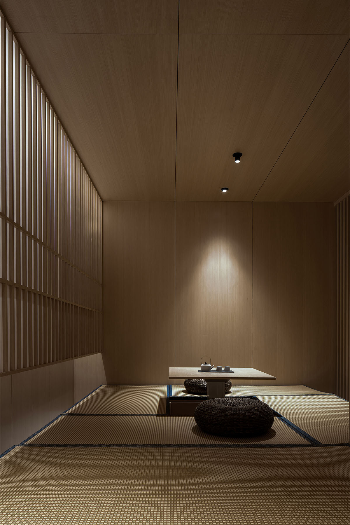 JST ARCHITECTURE creates dark-colored palette by adding a geometrical aesthetic to this showroom