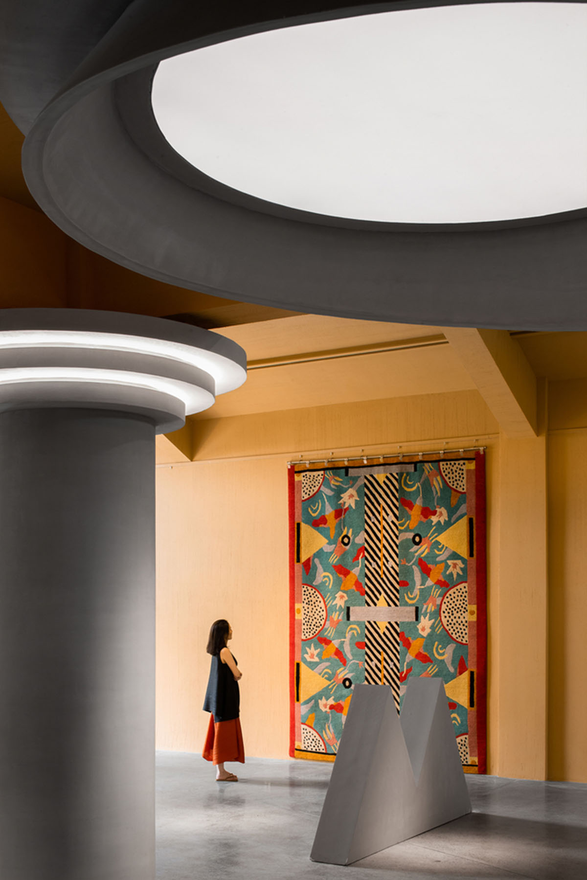 Angular corrugated stainless steel sheets form this showroom designed by PIG DESIGN in Hangzhou