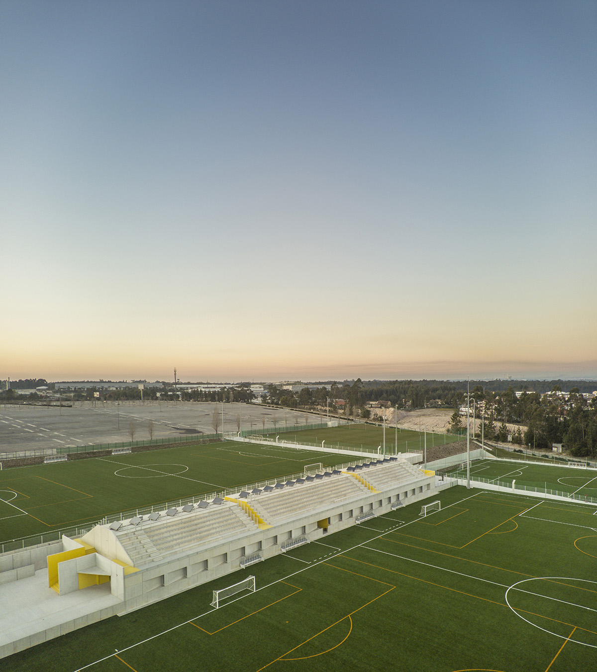 Summary highlights circulation and public areas of training facility of stadium with yellow color