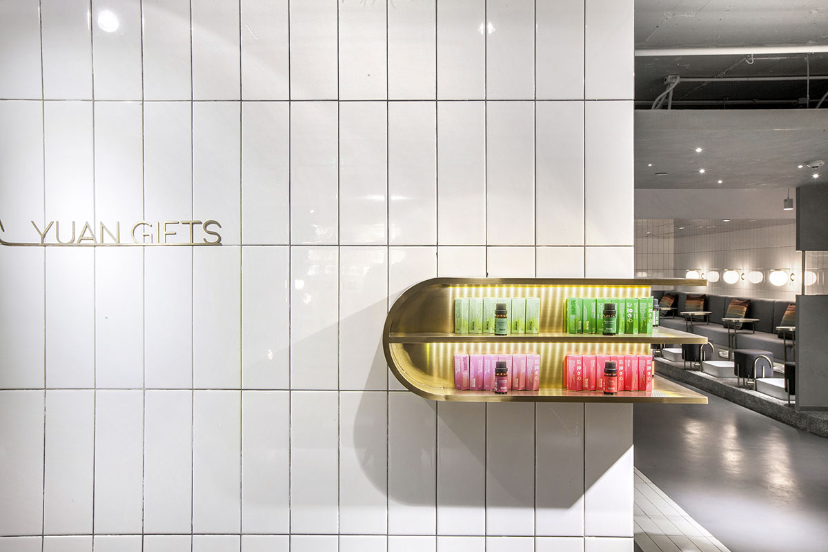 Towodesign uses metallic colors and golden pieces to create a retro atmosphere for this health store