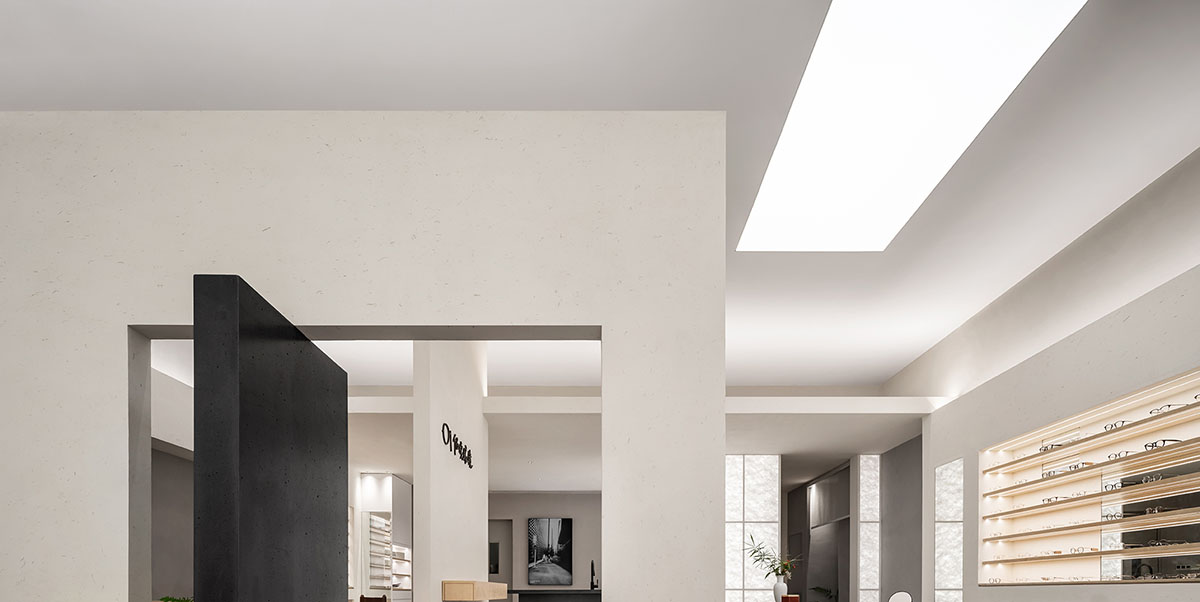 Luminous screen walls create fluid interiors for an optic store designed by Onexn Architects 