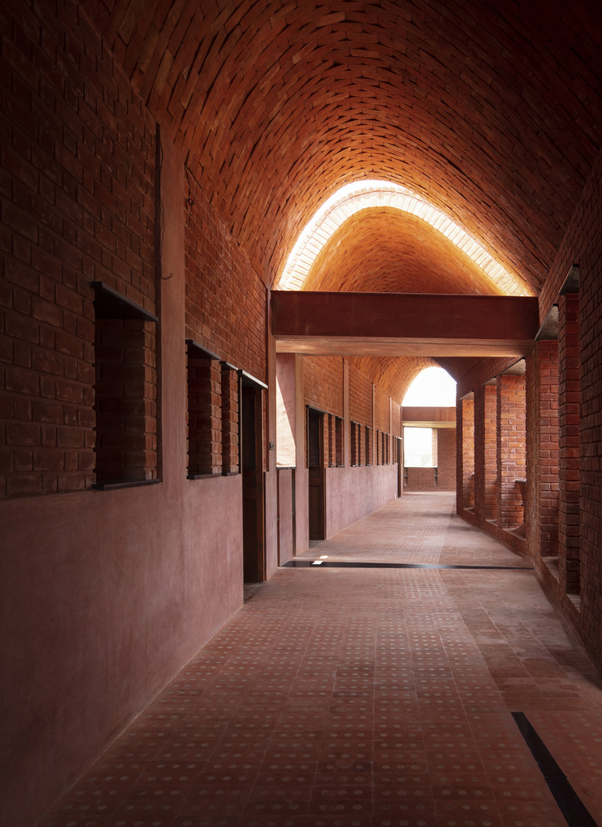 A school built from tilted brick vaults evoke a child's freedom in India