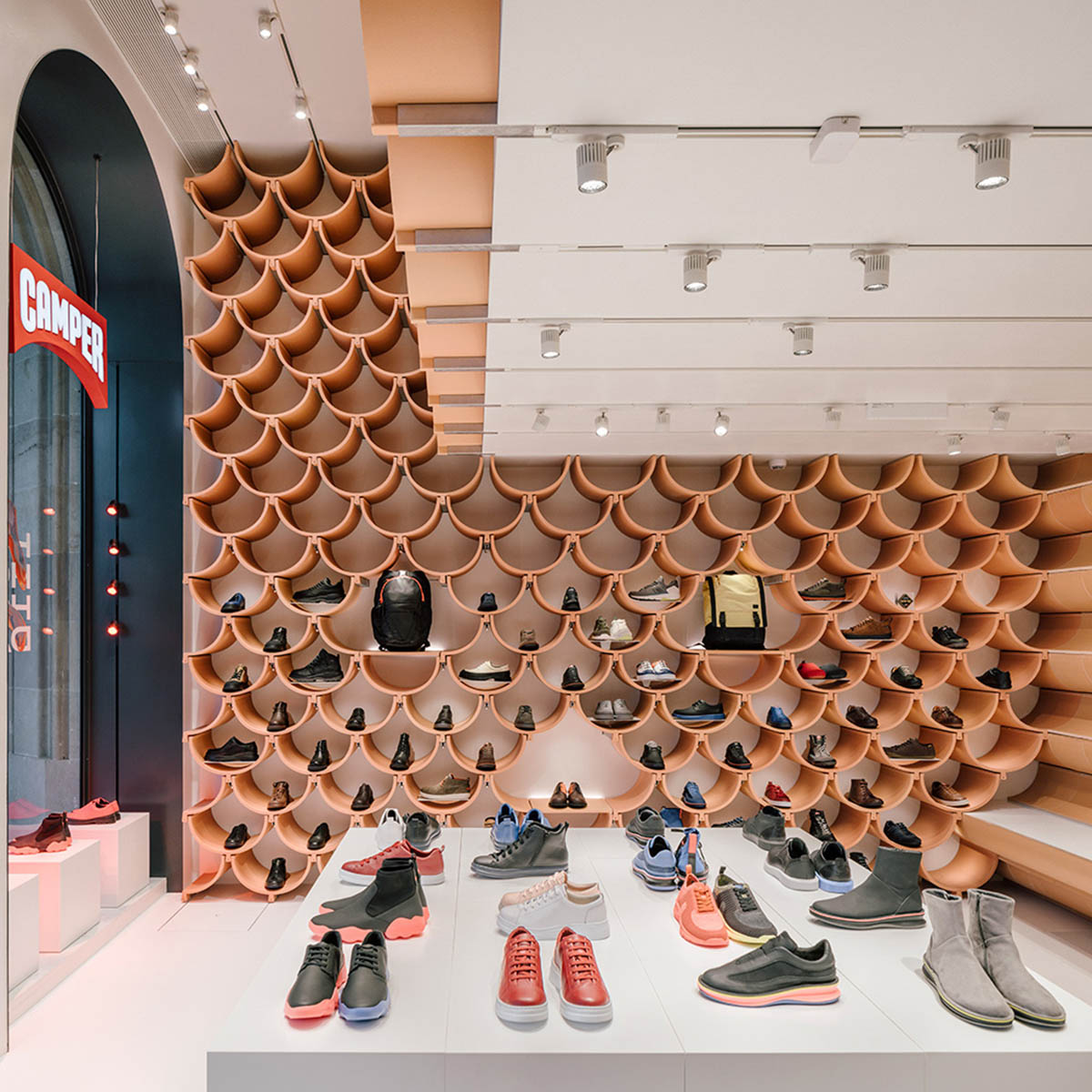 Kengo Kuma and Associates renovates Camper’s first shop in Barcelona with vault-shaped ceramic plates