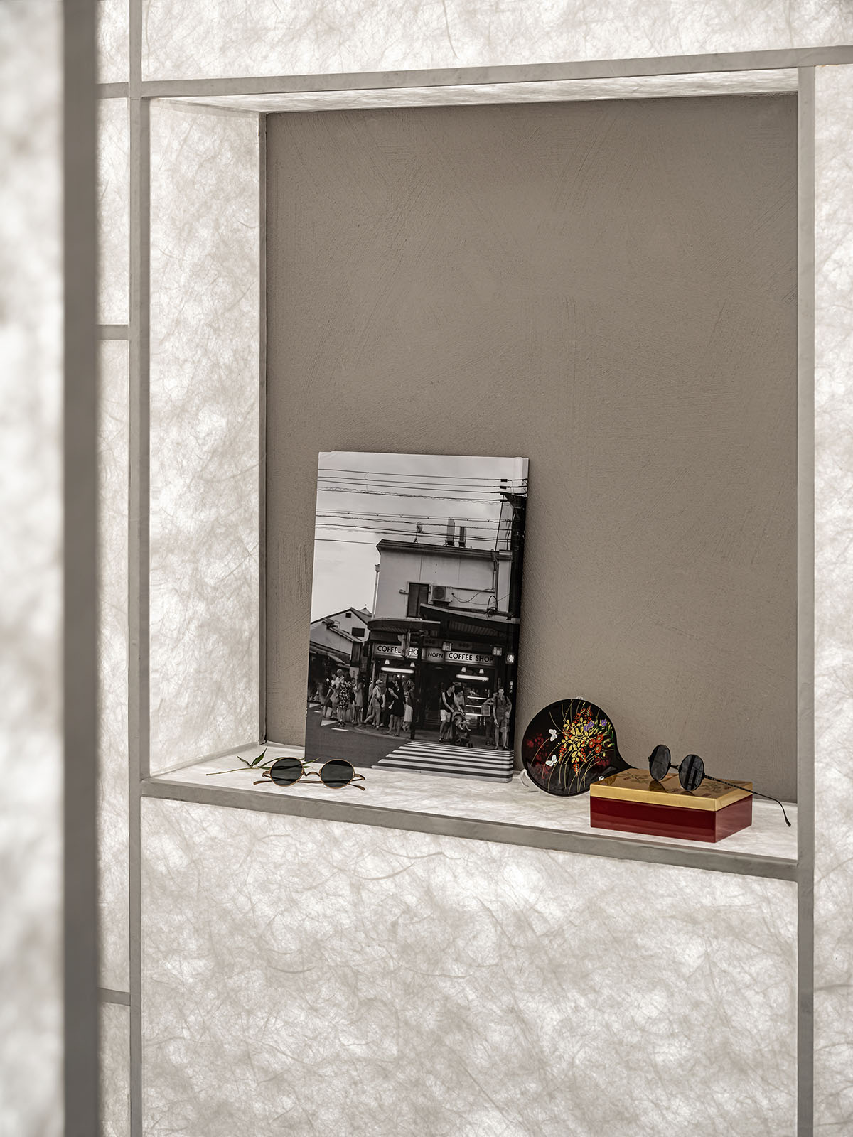 Luminous screen walls create fluid interiors for an optic store designed by Onexn Architects 