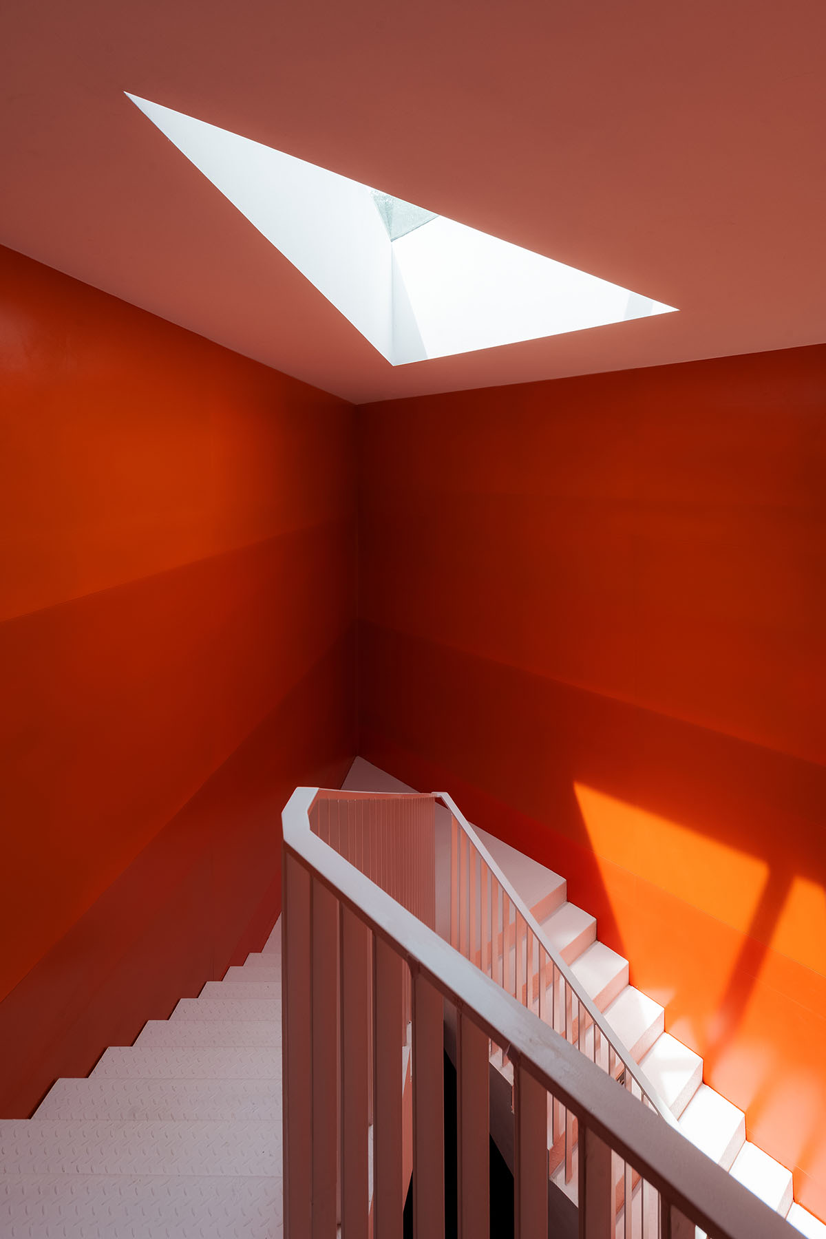 Wutopia Lab elaborates bookstore with red triangular bookshelves for Tianya Books in China 