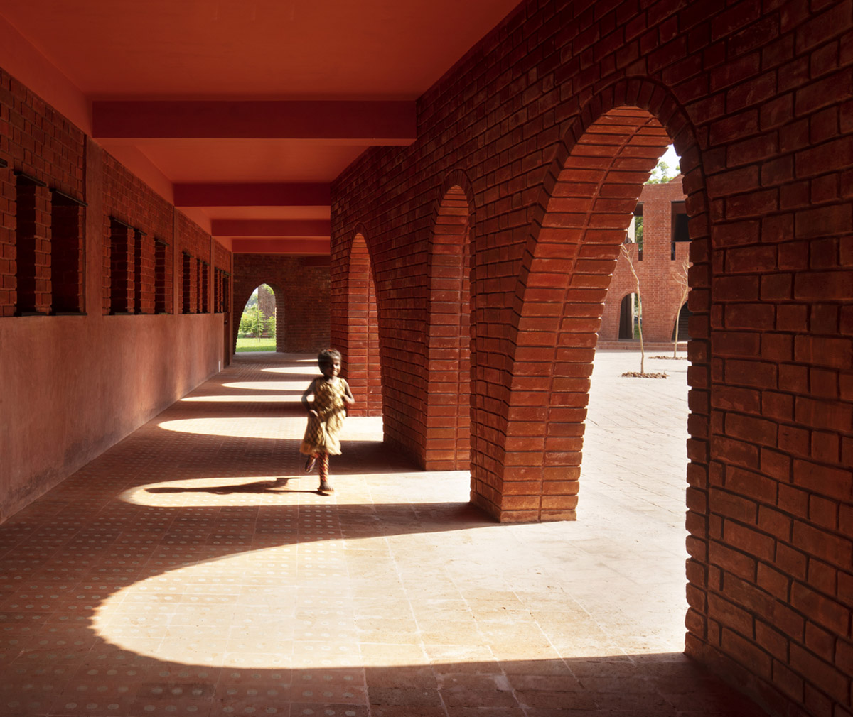 A school built from tilted brick vaults evoke a child's freedom in India