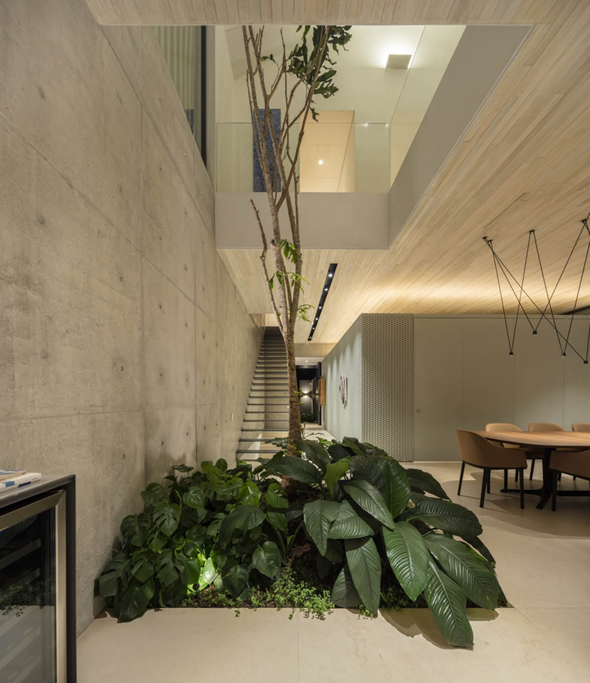Studio AG designed large wooden residence featuring punctured volumes with gabled roof in São Paulo