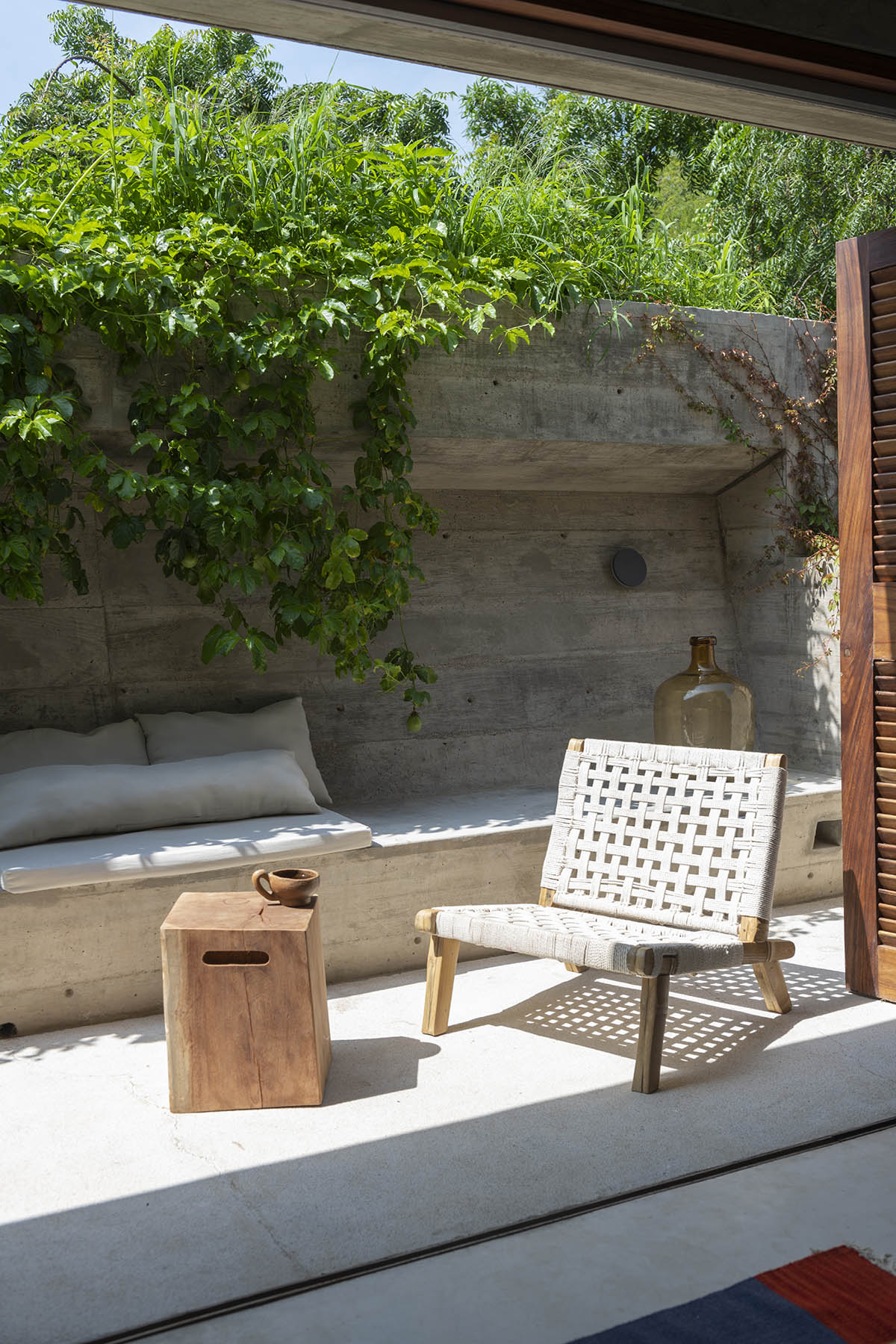 Casa TO by Ludwig Godefroy features an island of stairs and vaulted volumes to create discreet oasis