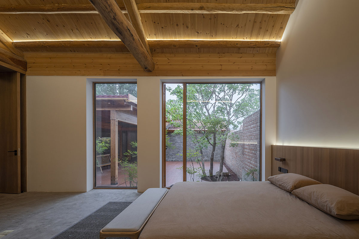 Archstudio renovates Beijing's old courtyard house with new wooden additions 