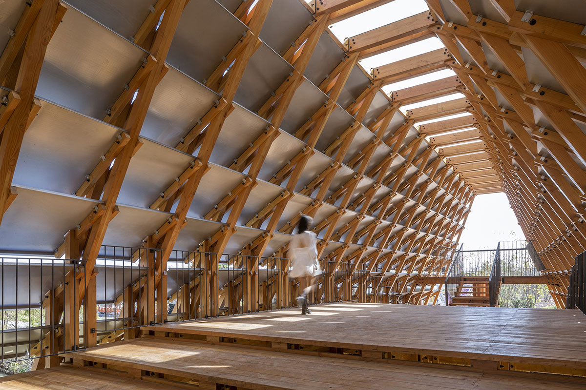 Arched timber bridge by LUO studio allows boats to pass under bridge smoothly in Gulou waterfront