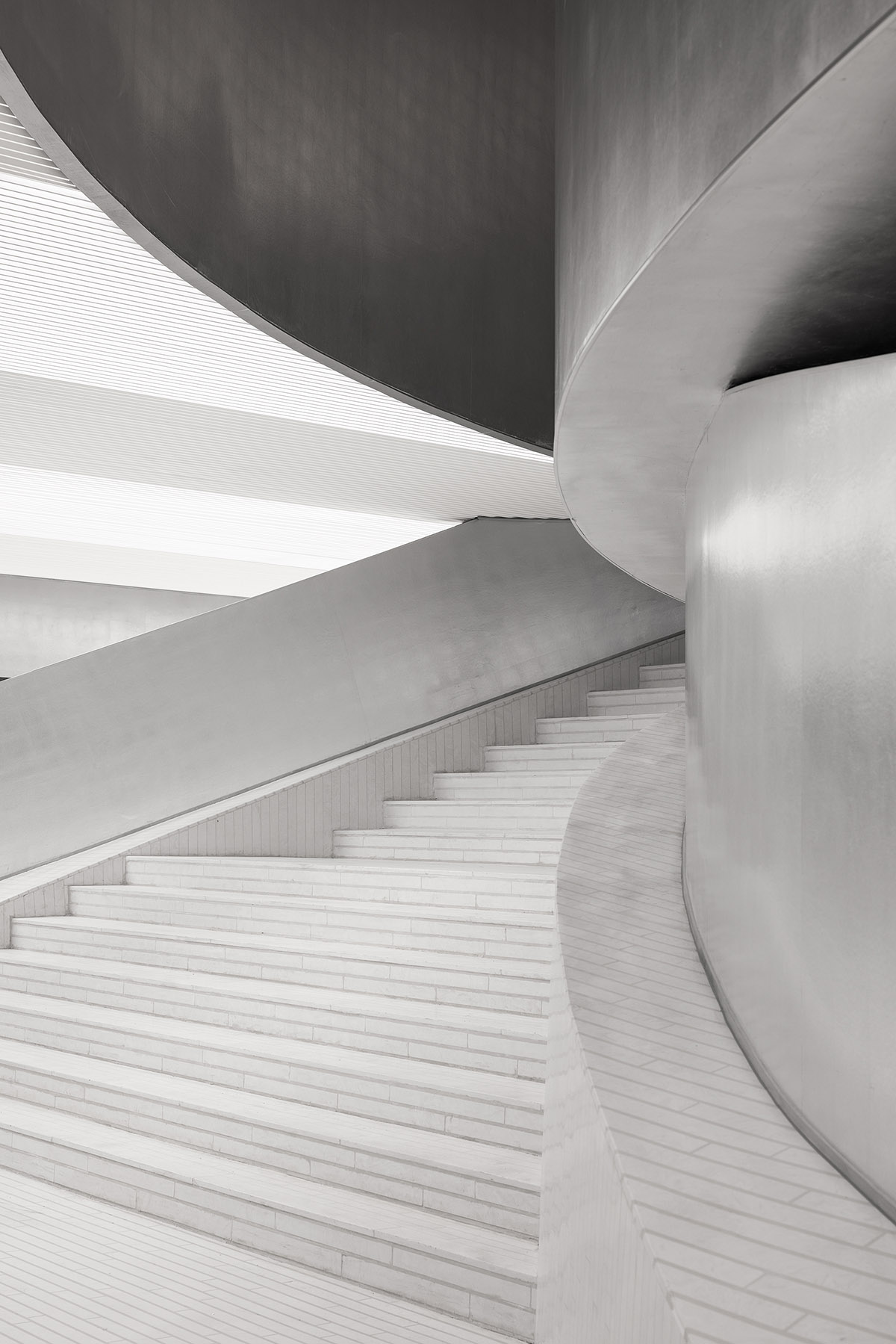 Various Associates designs beauty store with winding staircase and silver-toned interiors in Hangzhou