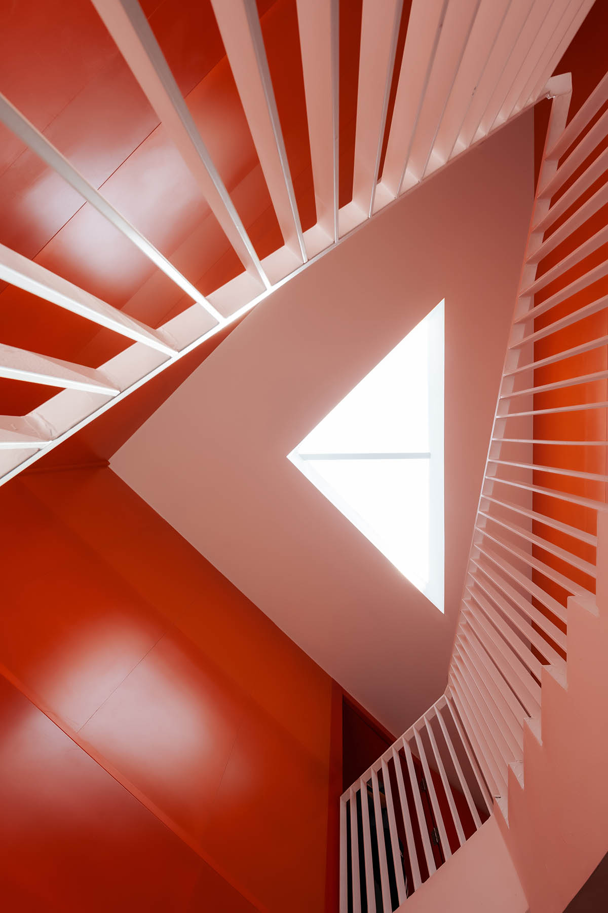 Wutopia Lab elaborates bookstore with red triangular bookshelves for Tianya Books in China 