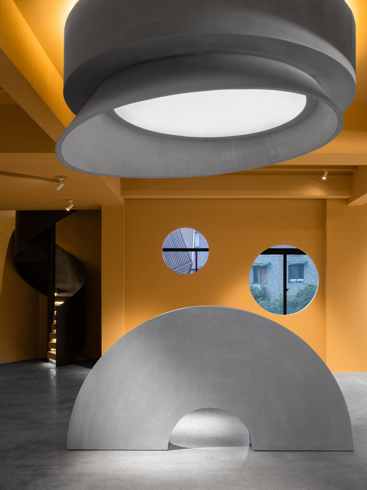 Angular corrugated stainless steel sheets form this showroom designed by PIG DESIGN in Hangzhou